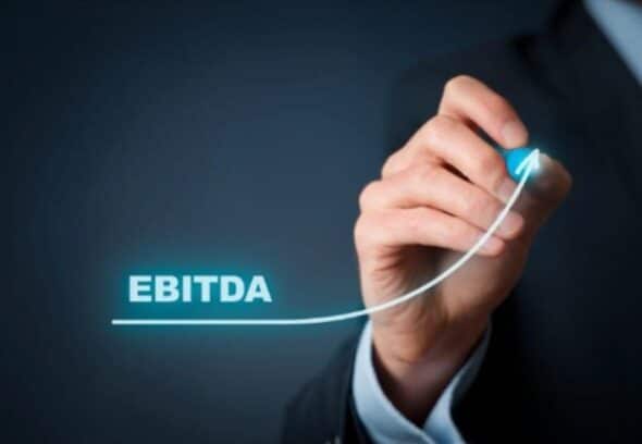 Hand drawing an upward graph line of EBITDA